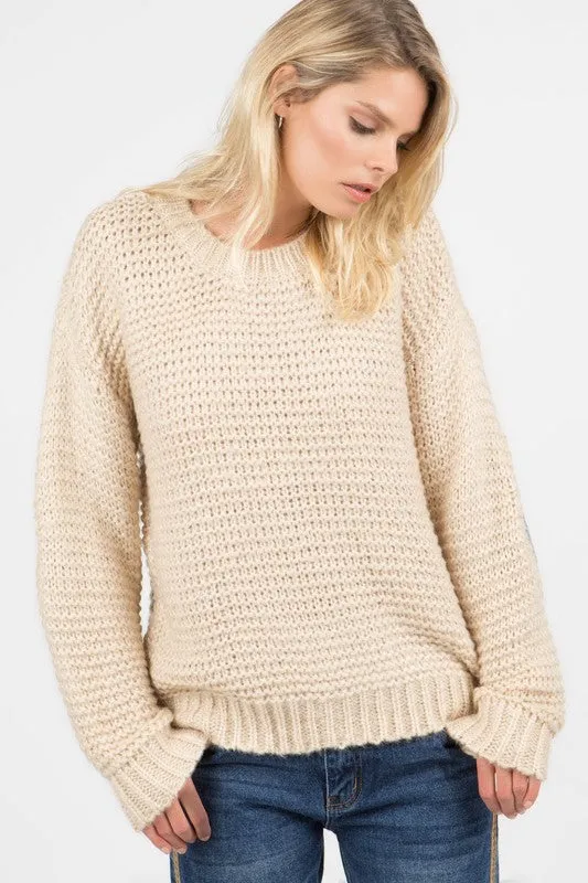 Basic ribbed pullover sweater with multi-colored floral elbow patch