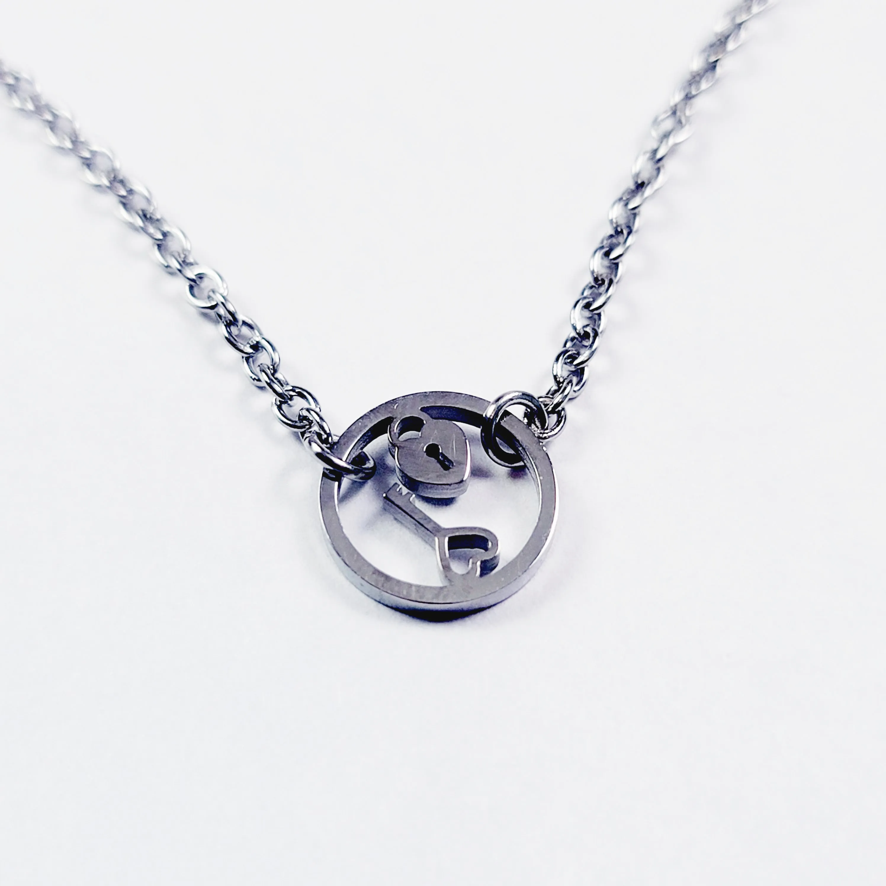 Day Collar, Stainless Steel with Circle of O Heart Locket and Key Pendant. 24/7 Wear Discreet Collar